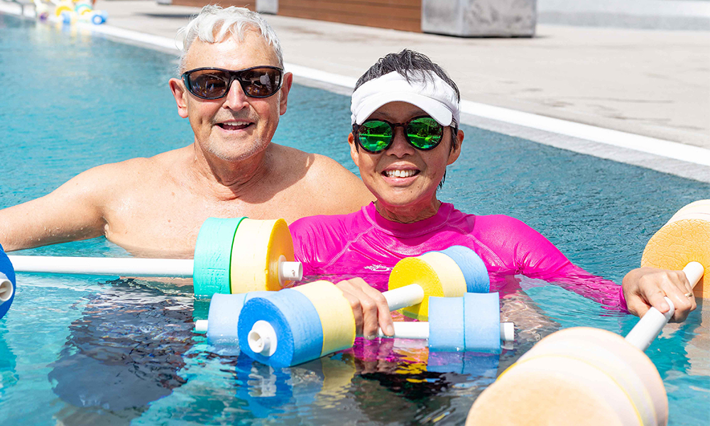 couple doing aqua exercises at the Mount Hot Pools in Mount Maunganui